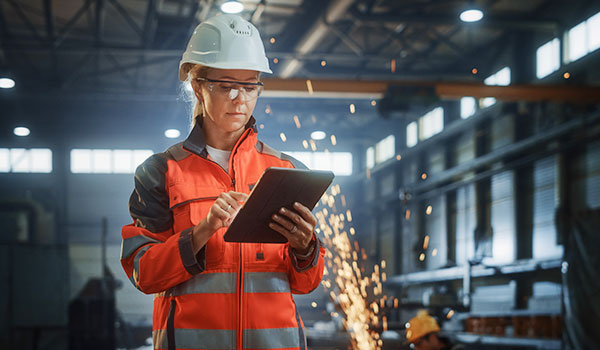 Female industrial worker with tablet