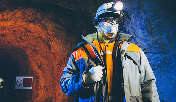 Miner wearing protecting gear