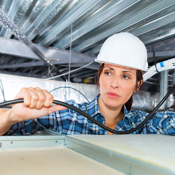 woman electrician installation
